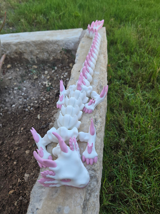 Articulated axolotl dragon fidget shown from a second angle