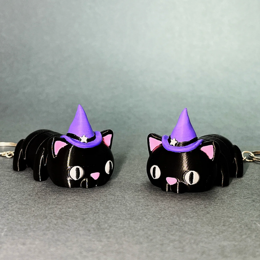 Pair of Flexi Halloween Cat keychains with witch hats