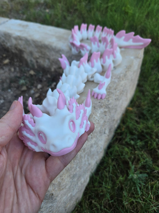 Articulated axolotl dragon fidget, 3D printed with a fully flexible printed spine