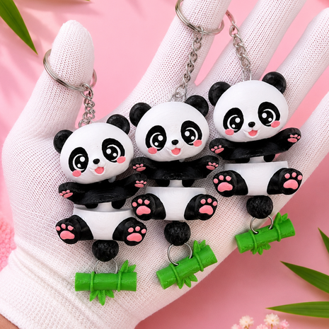 Three Flexi Baby Panda keychains close-up