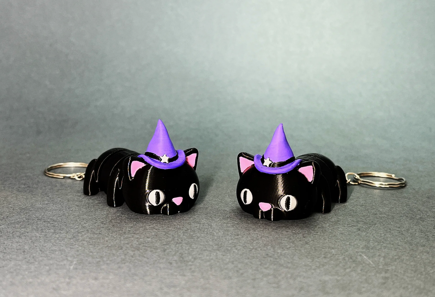 Pair of Flexi Halloween Cat keychains with witch hats