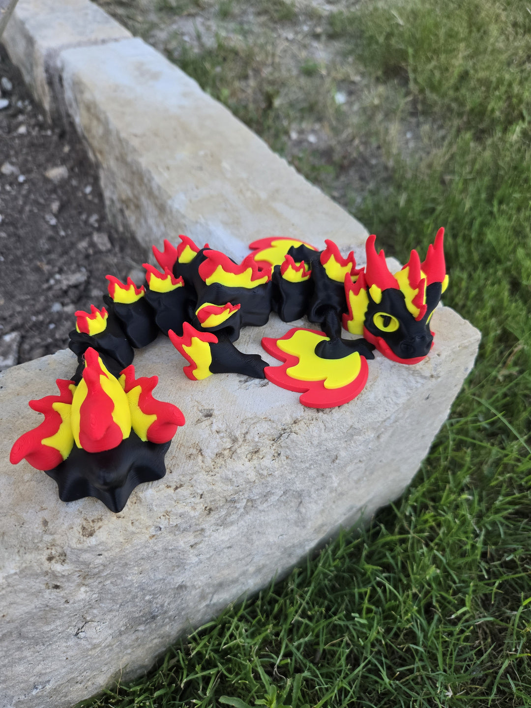 Eternal Flame Wyvern articulated dragon fidget resting on stone